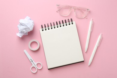 Photo of Flat lay composition with notebook on pink background