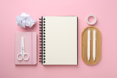 Photo of Flat lay composition with notebooks on pink background