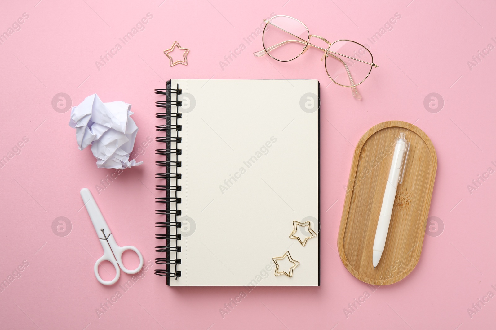 Photo of Flat lay composition with notebook on pink background