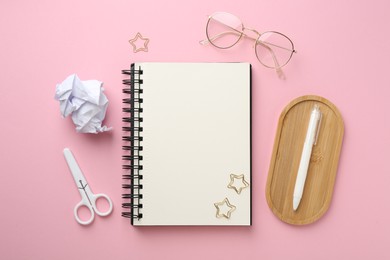 Photo of Flat lay composition with notebook on pink background