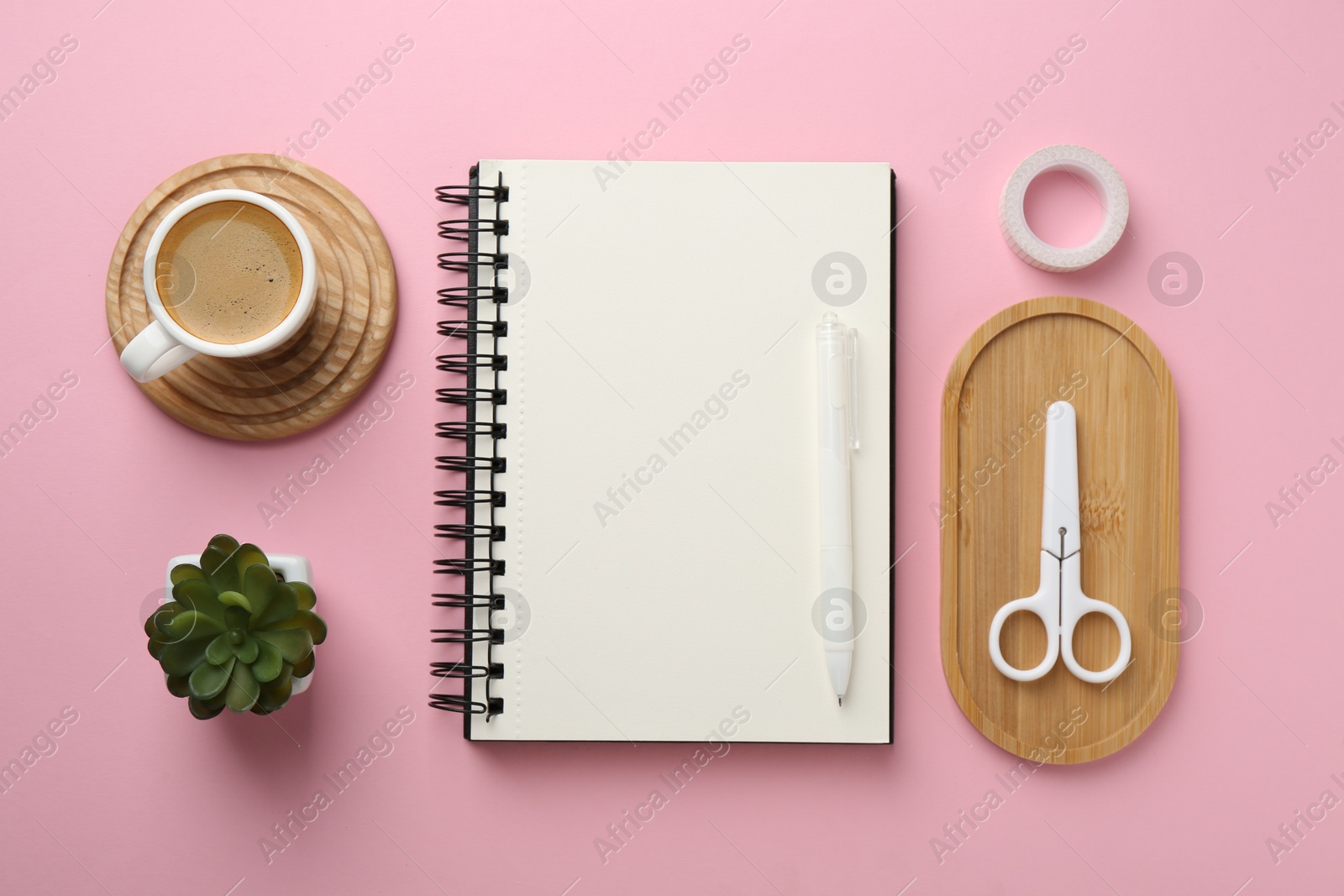 Photo of Flat lay composition with notebook on pink background