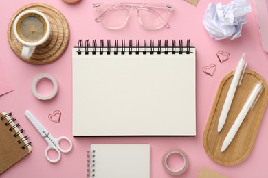 Photo of Flat lay composition with notebooks on pink background