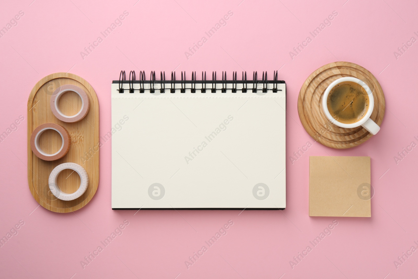 Photo of Flat lay composition with notebook on pink background