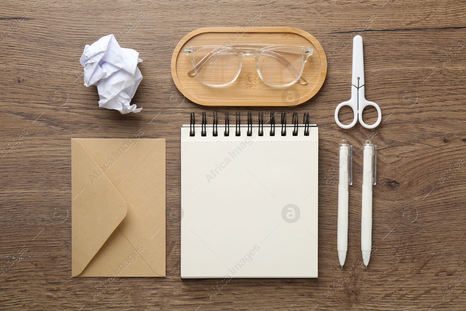 Photo of Flat lay composition with notebook on wooden table
