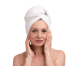 Photo of Beautiful woman with towel wrapped on her head against white background
