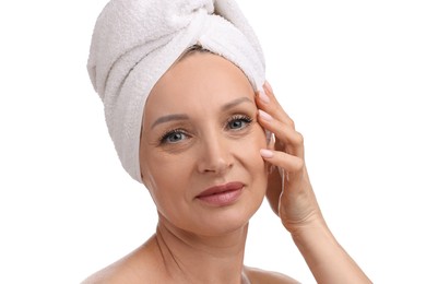 Photo of Beautiful woman with towel wrapped on her head against white background