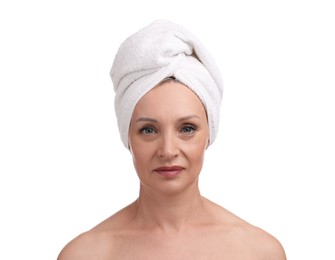Photo of Beautiful woman with towel wrapped on her head against white background