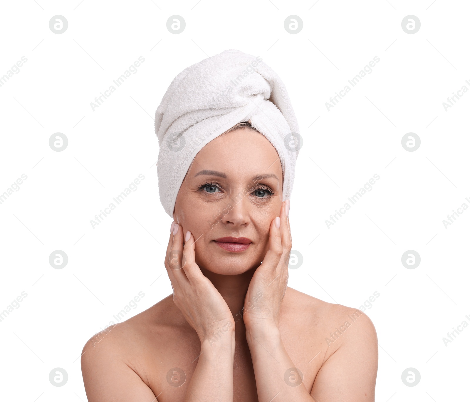 Beautiful woman with towel wrapped on her head against white background Photo of Beautiful woman with towel wrapped on her head against white background