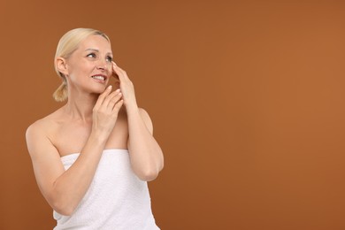 Photo of Portrait of beautiful woman on brown background. Space for text