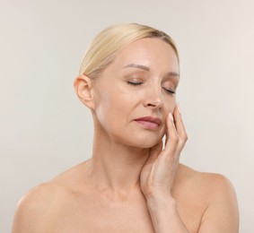 Photo of Portrait of beautiful woman on light background