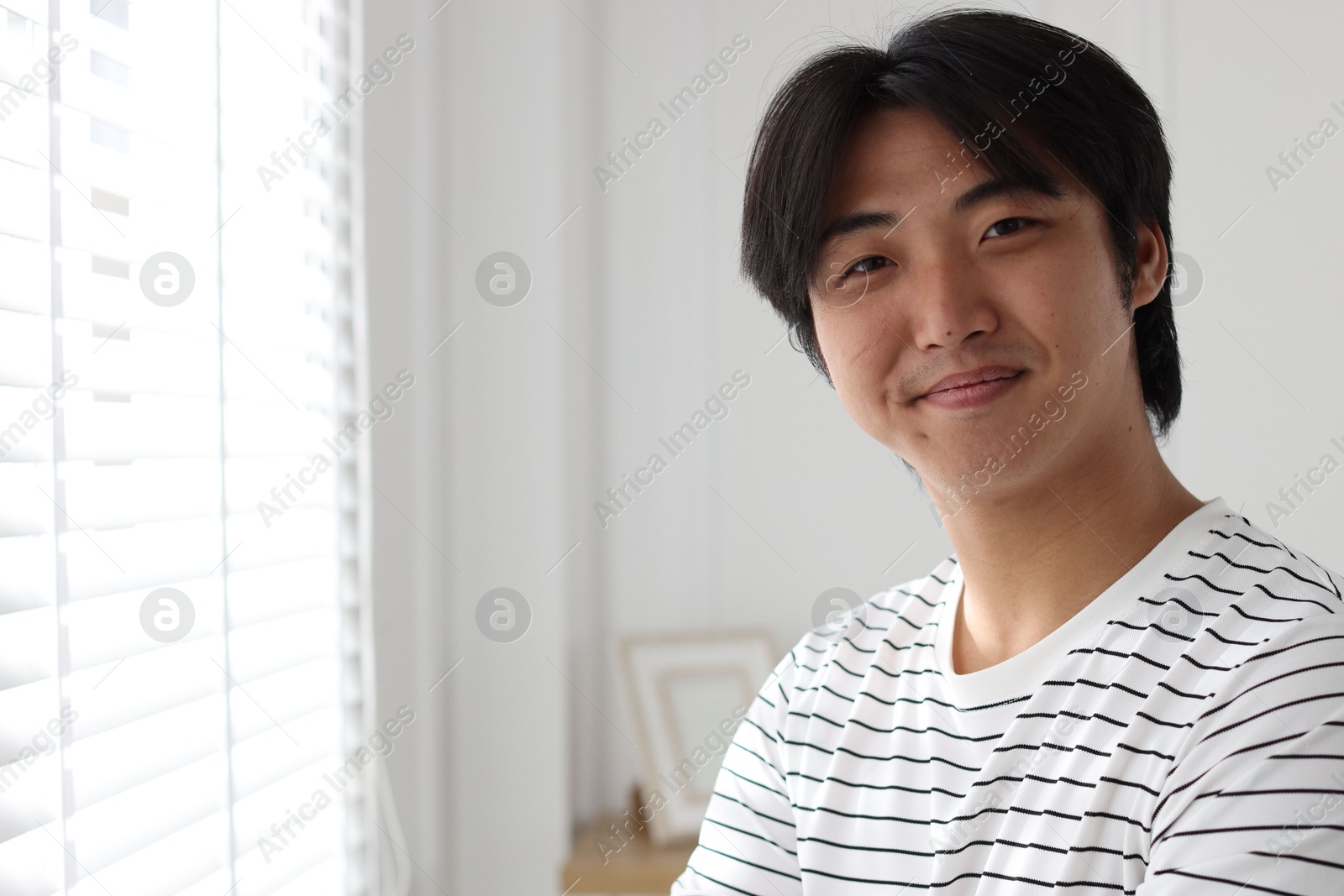 Portrait of handsome man at home. Space for text Photo of Portrait of handsome man at home. Space for text
