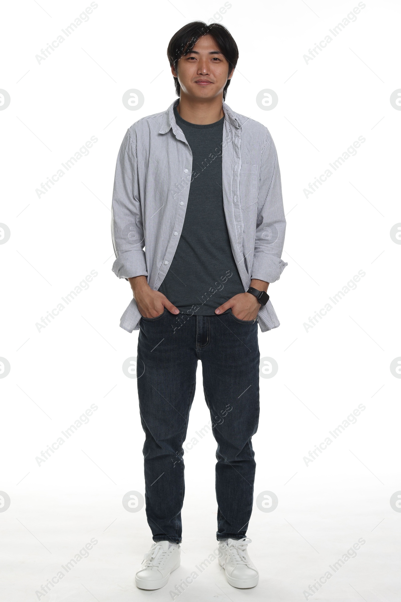 Handsome Asian man posing on white background Photo of Handsome Asian man posing on white background