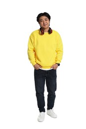 Photo of Handsome Asian man with headphones on white background