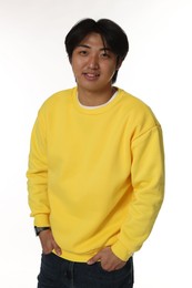 Photo of Portrait of smiling Asian man on white background