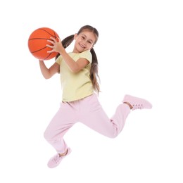 Photo of Little girl jumping with basketball ball on white background