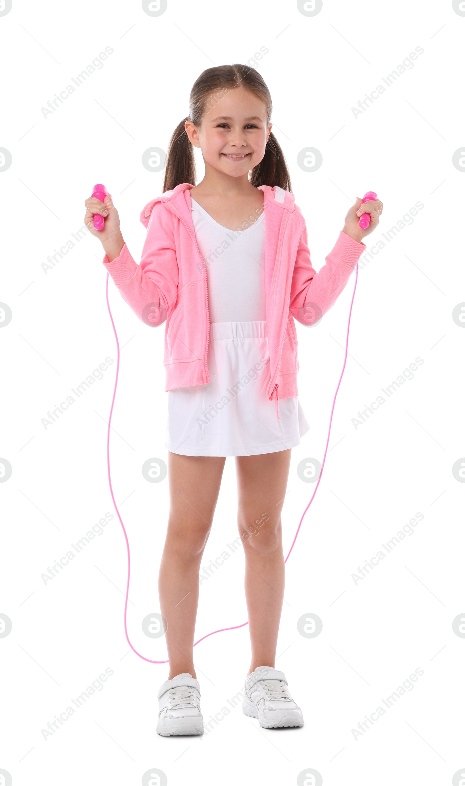 Little girl with skipping rope on white background Photo of Little girl with skipping rope on white background