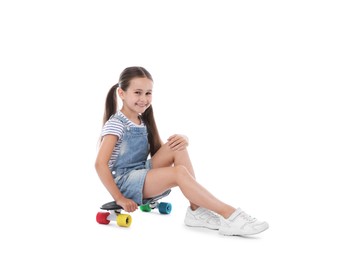 Photo of Little girl with penny board on white background