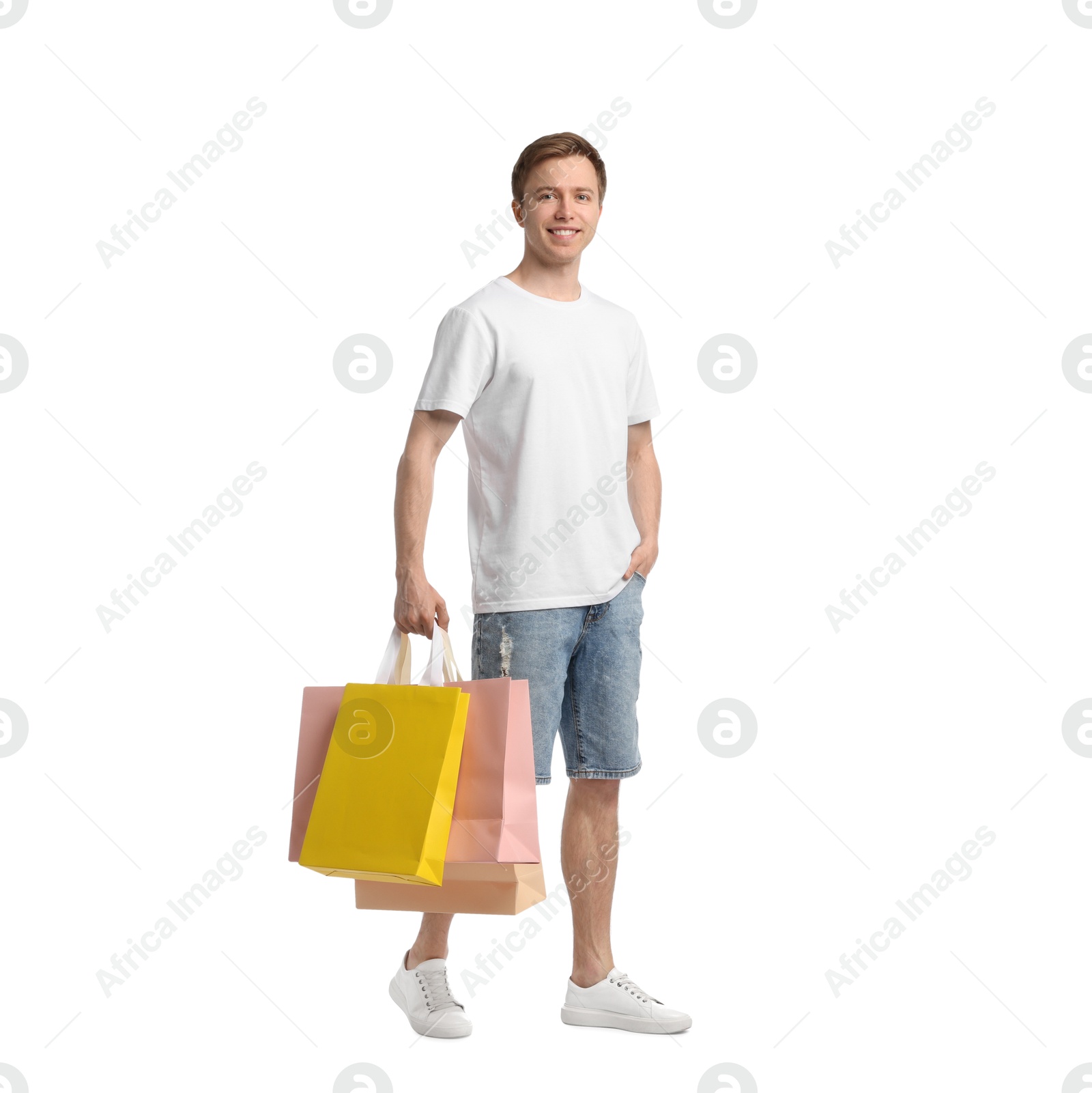Cheerful man with shopping bags on white background Photo of Cheerful man with shopping bags on white background