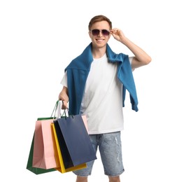 Photo of Cheerful man with shopping bags on white background