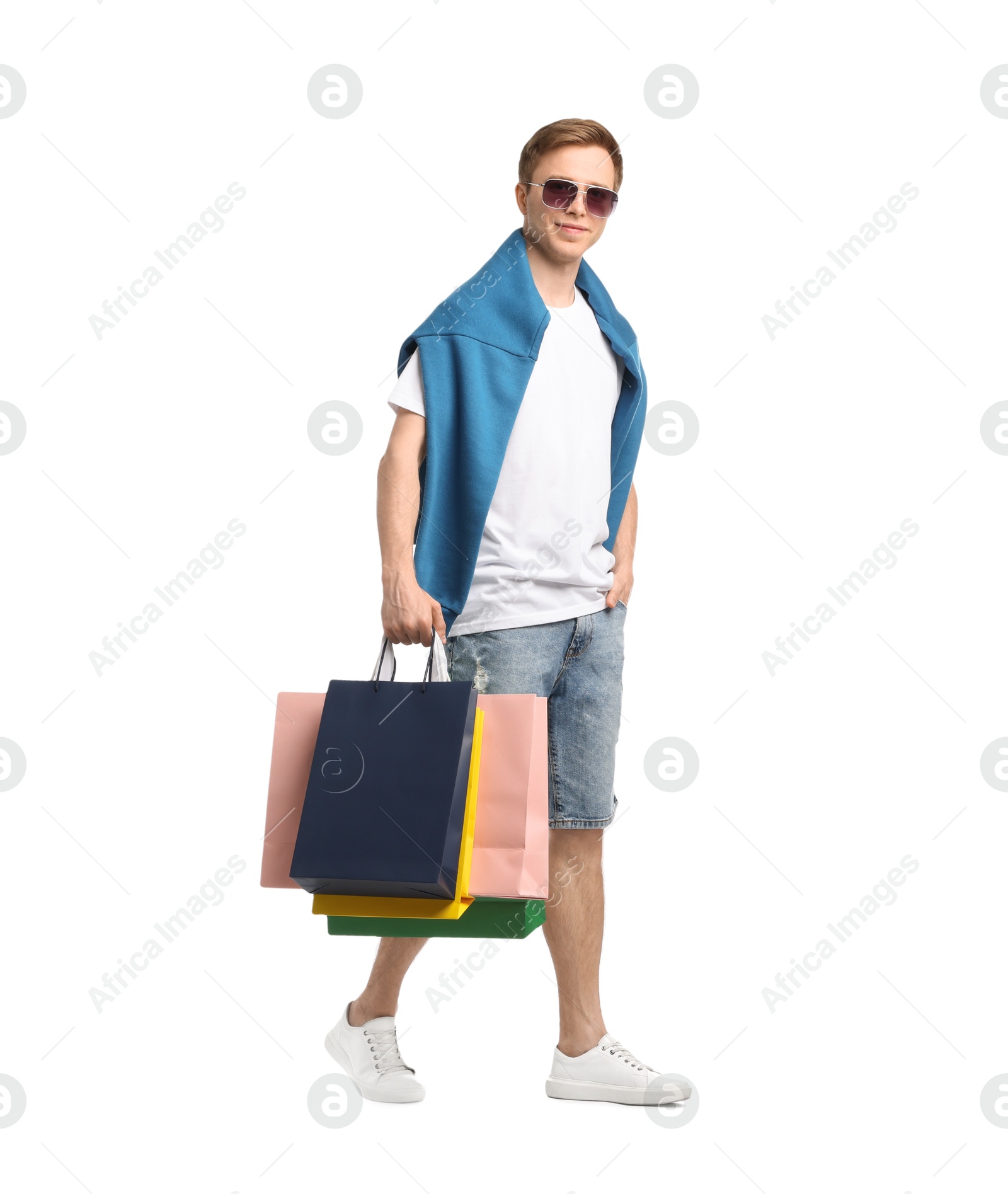 Cheerful man with shopping bags on white background Photo of Cheerful man with shopping bags on white background