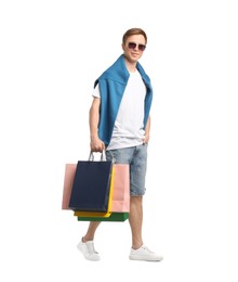 Photo of Cheerful man with shopping bags on white background