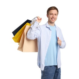 Photo of Cheerful man with shopping bags on white background