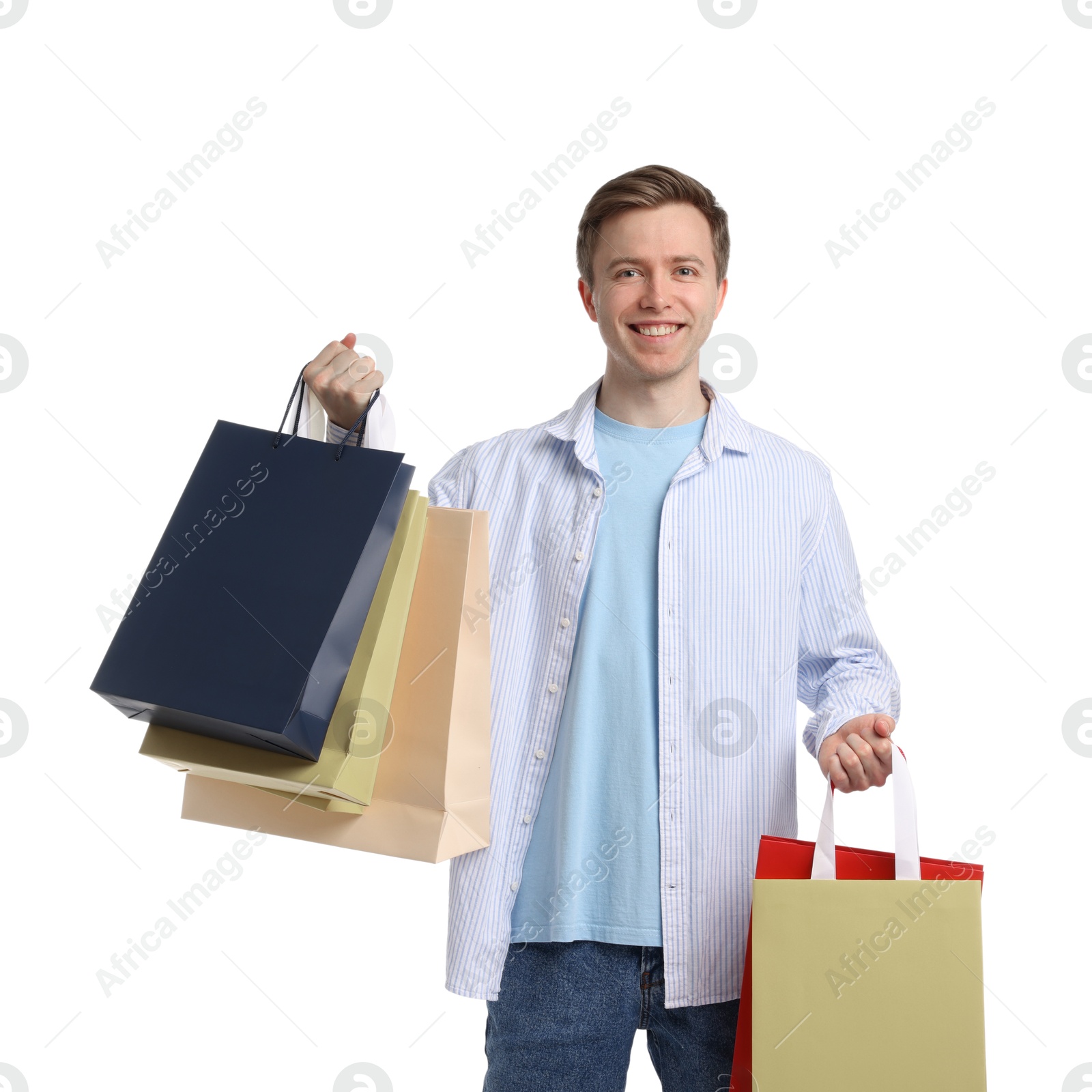 Cheerful man with shopping bags on white background Photo of Cheerful man with shopping bags on white background