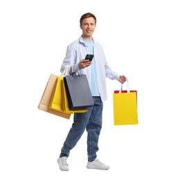 Photo of Cheerful man with shopping bags on white background