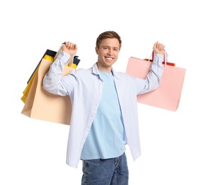Photo of Cheerful man with shopping bags on white background