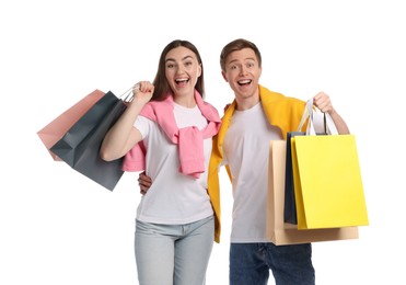Photo of Happy couple with shopping bags on white background