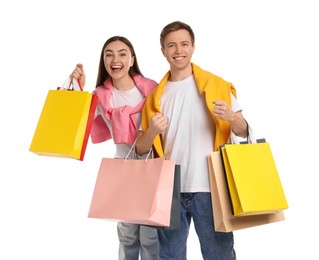 Photo of Happy couple with shopping bags on white background
