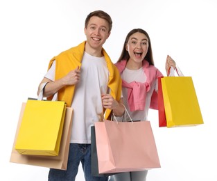 Photo of Happy couple with shopping bags on white background