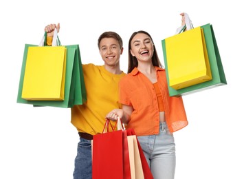 Photo of Happy couple with shopping bags on white background