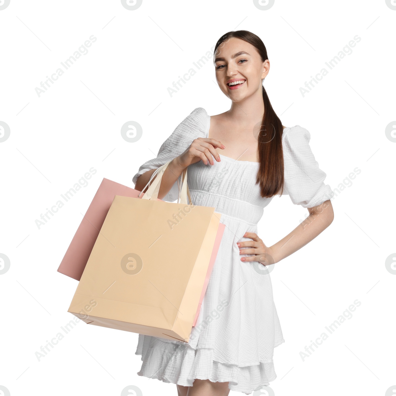 Positive woman with shopping bags on white background Photo of Positive woman with shopping bags on white background