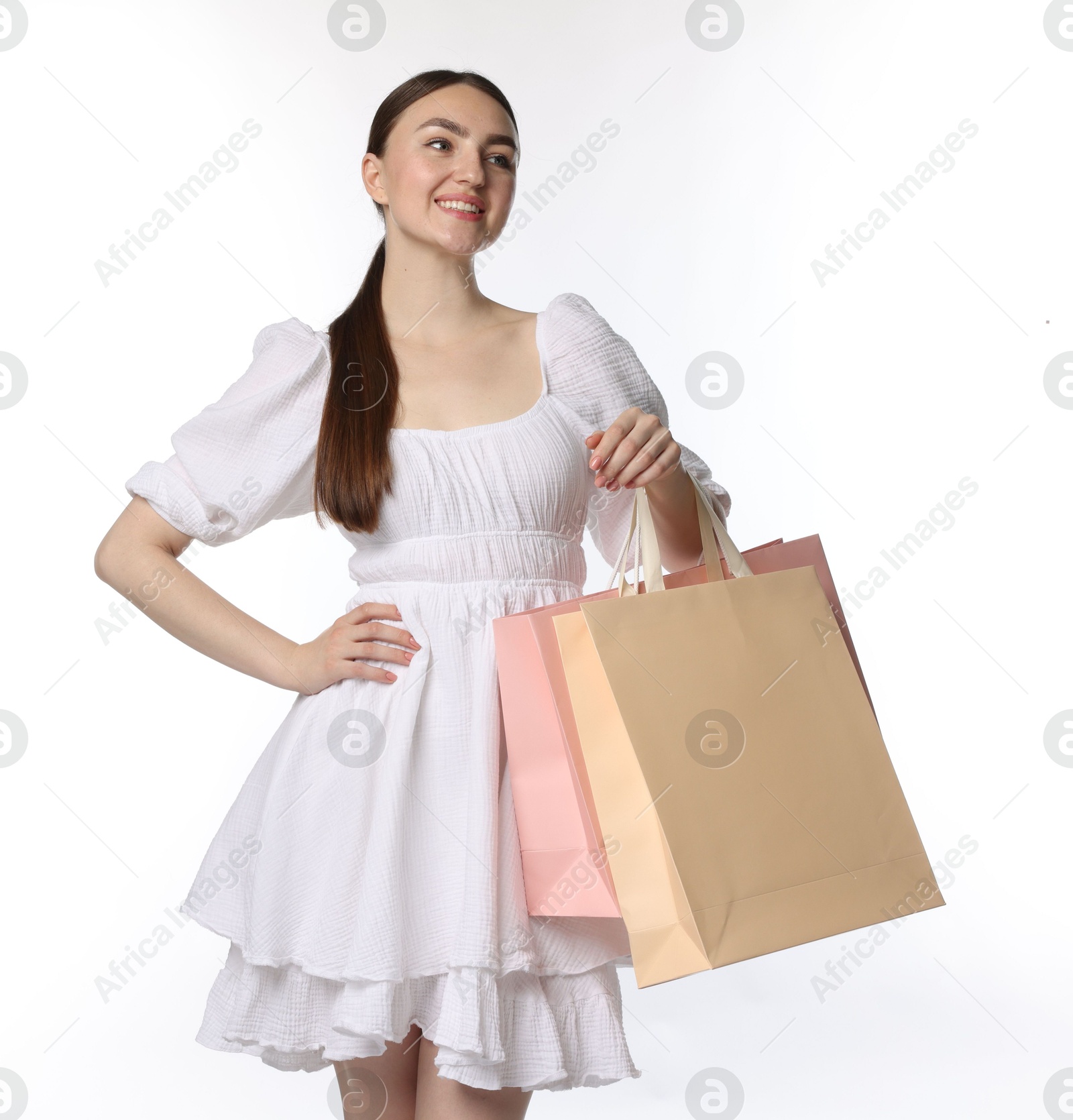 Positive woman with shopping bags on white background Photo of Positive woman with shopping bags on white background