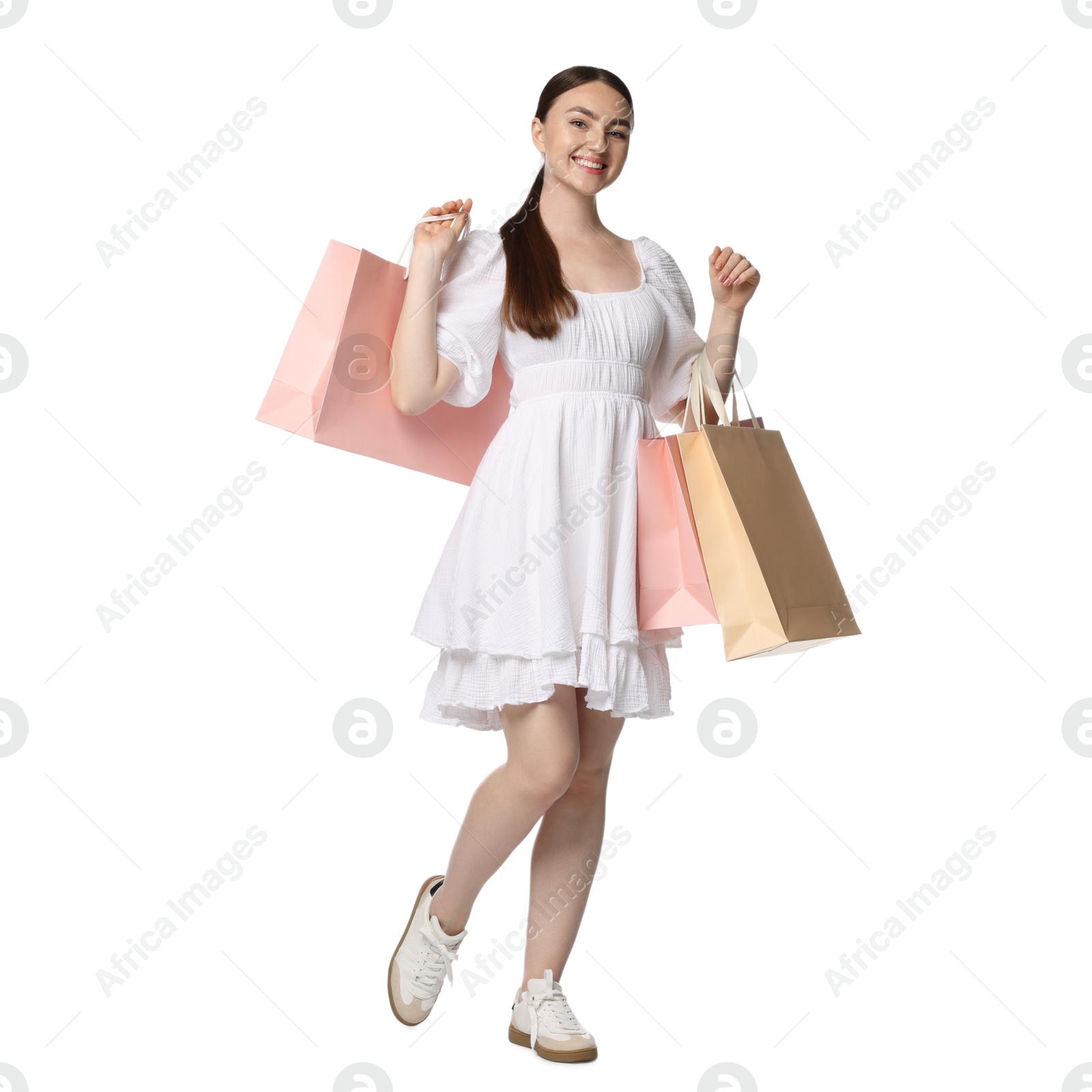 Positive woman with shopping bags on white background Photo of Positive woman with shopping bags on white background