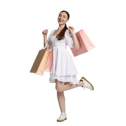 Photo of Positive woman with shopping bags on white background