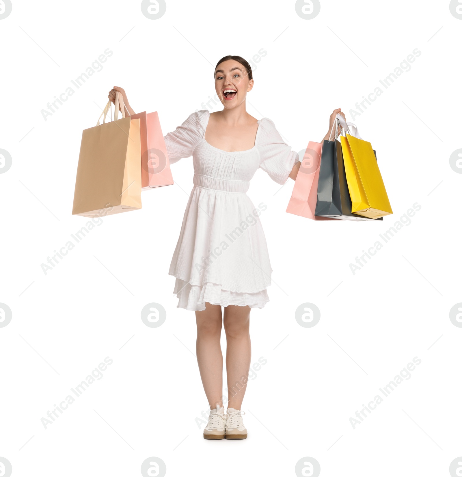 Positive woman with shopping bags on white background Photo of Positive woman with shopping bags on white background
