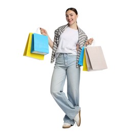Photo of Positive woman with shopping bags on white background