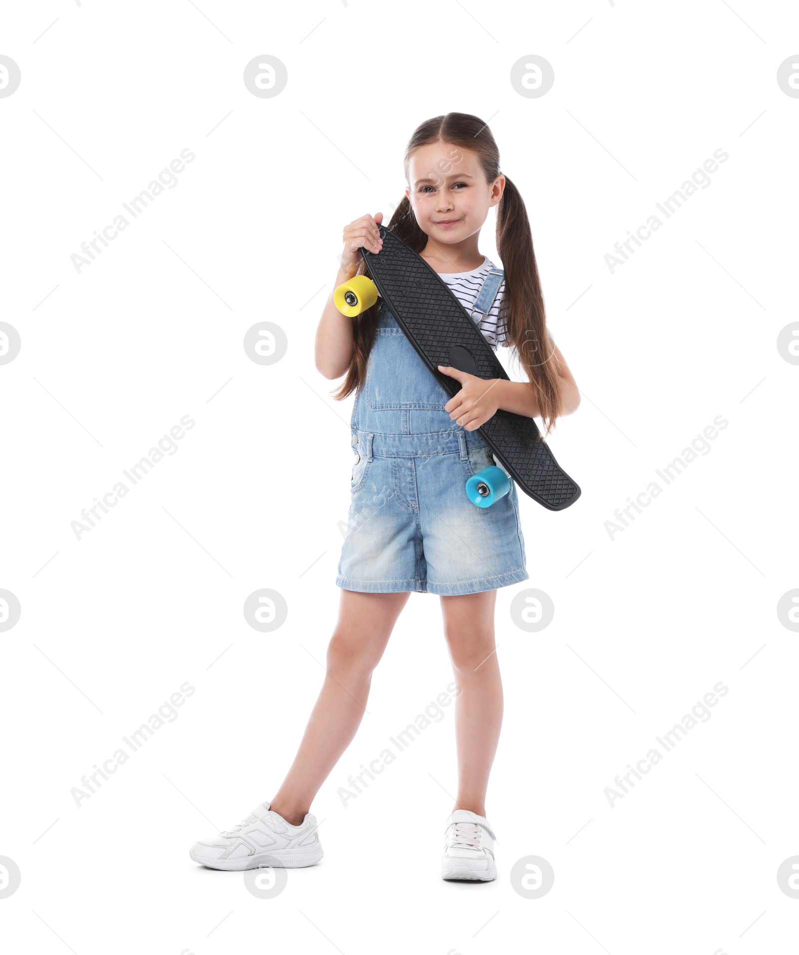 Little girl with penny board on white background Photo of Little girl with penny board on white background