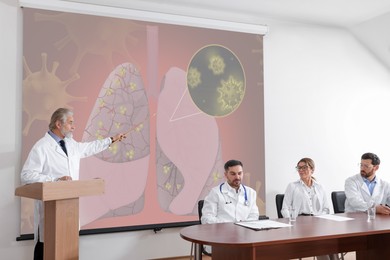 Image of Healthcare professional giving lecture about lung diseases in conference room using video projector. Illustration on projection screen