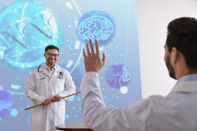 Image of Healthcare professional giving lecture about DNA in conference room using video projector. Illustrations on projection screen