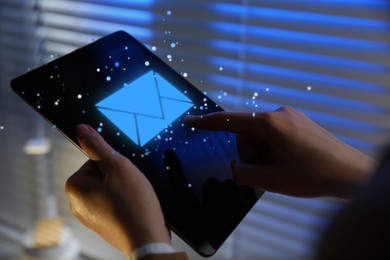 Image of Email marketing, new message notification. Woman using tablet computer indoors, closeup