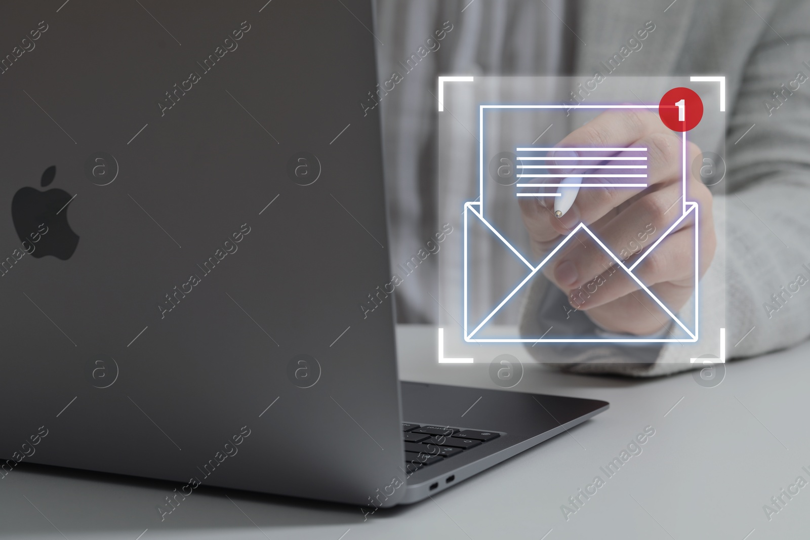 Email marketing, new message notification. Man using virtual screen near laptop at table, closeup Image of Email marketing, new message notification. Man using virtual screen near laptop at table, closeup