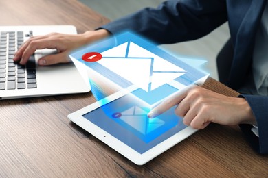 Image of Email marketing, new message notification above device. Woman using tablet computer and laptop at table, closeup