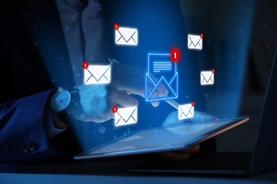 Image of Email marketing, new message notification. Man using tablet computer at table, closeup