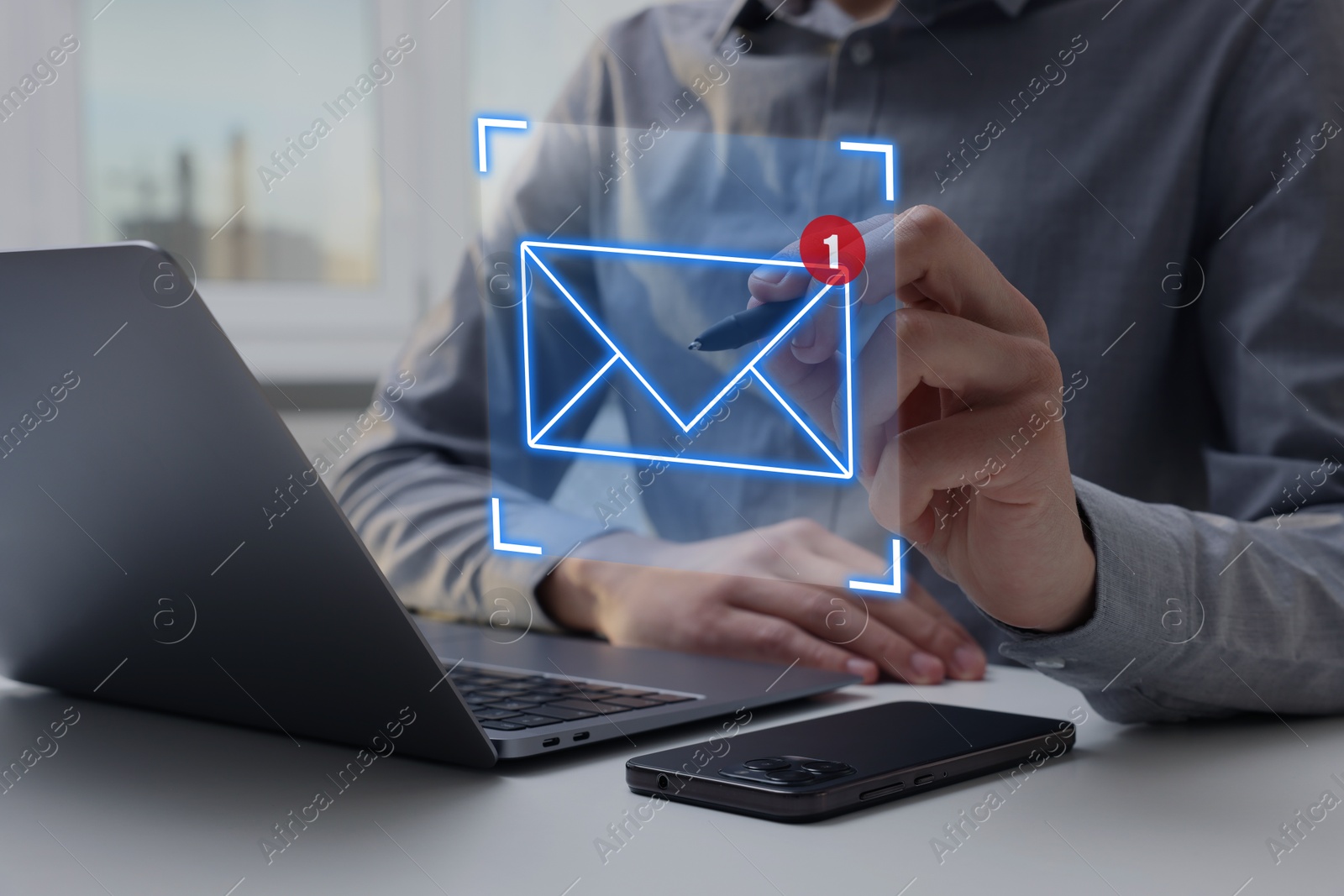 Image of Email marketing, new message notification. Man using virtual screen above laptop at table, closeup