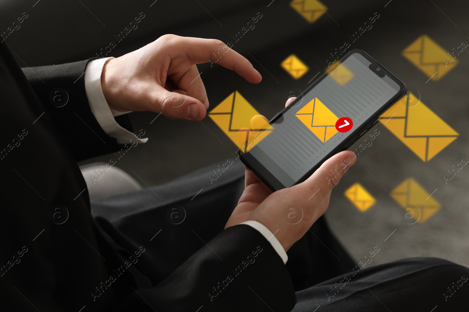 Email marketing, new message notification. Man using mobile phone indoors, closeup. Envelopes around device Image of Email marketing, new message notification. Man using mobile phone indoors, closeup. Envelopes around device