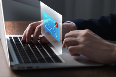 Image of Email marketing, new message notification. Man using laptop at table, closeup