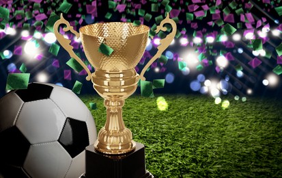 Image of Football championship. Shiny golden trophy cup and soccer ball under falling confetti on stadium, banner design